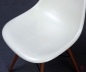 Preview: Vitra Fiberglas DSW Side Chair in Parchment beige mit Holz Gestell gebraucht
