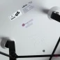 Preview: Vitra Eames Plastic Armchair in Weiß mit schwarzem Sitzpolster gebraucht